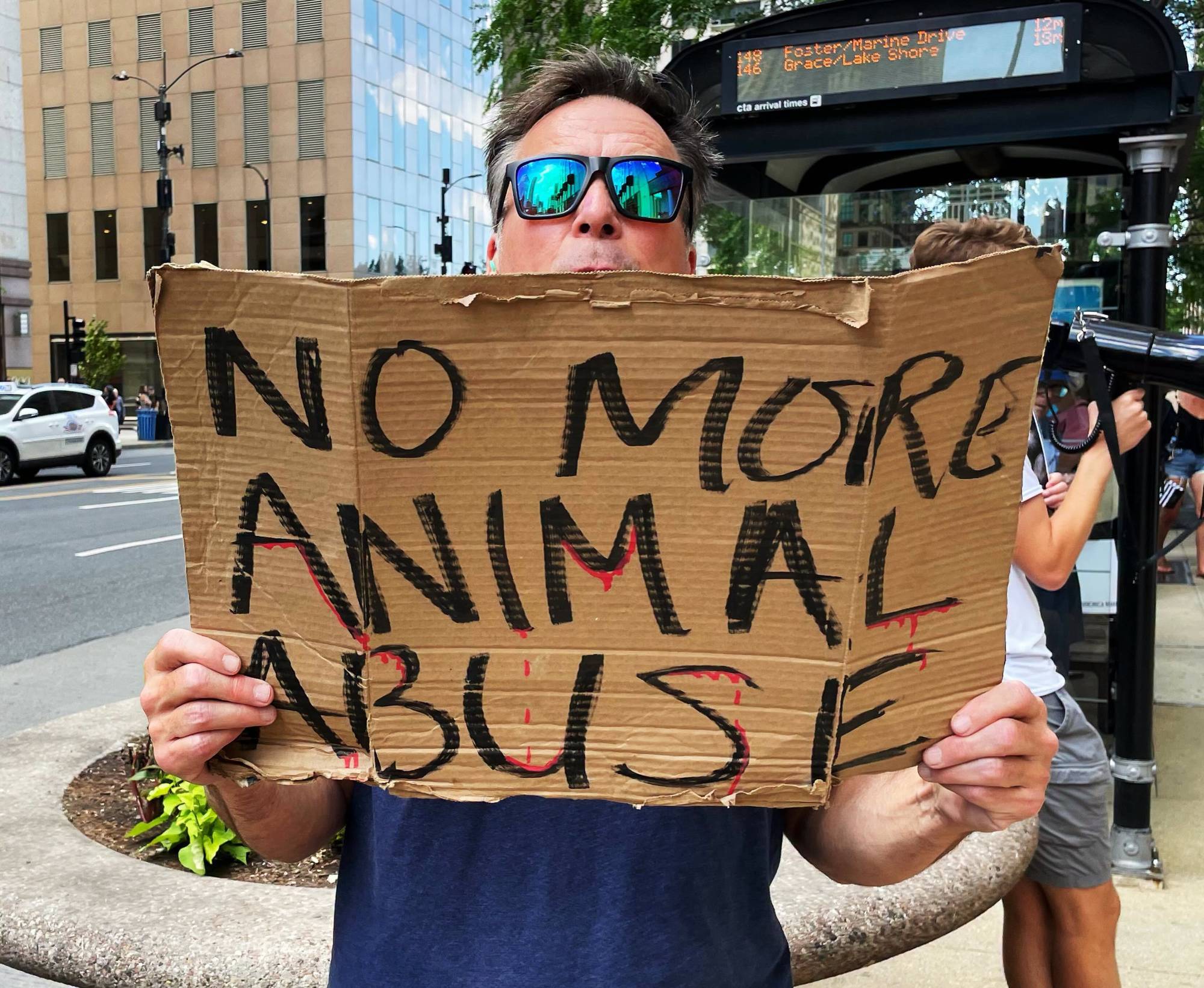 "No more animal abuse," sign says