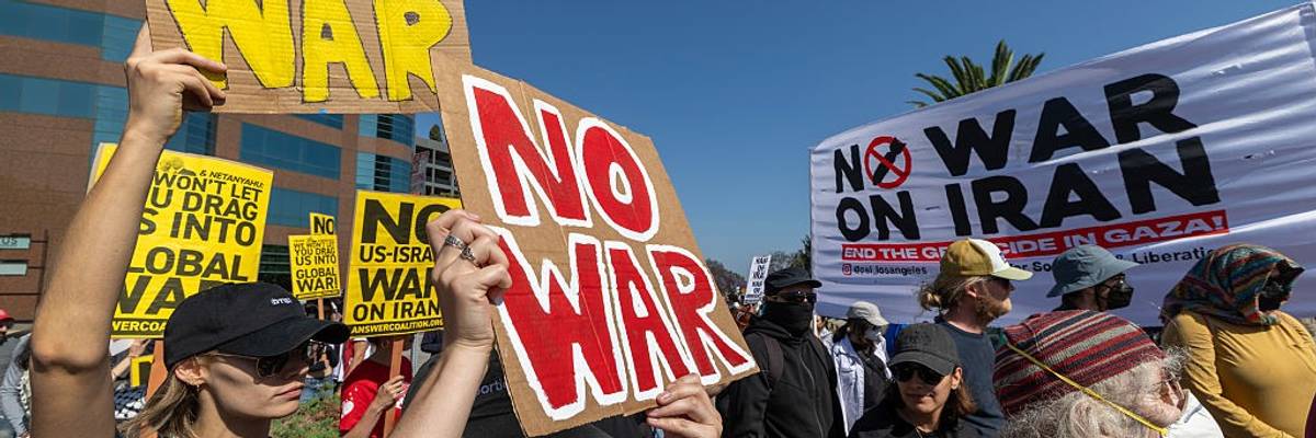 "No War" signs at anti-Trump protest