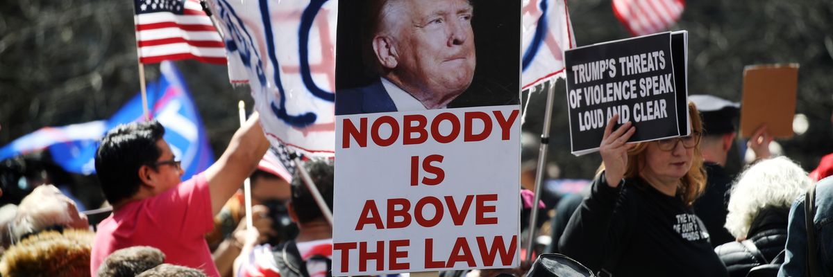 "Nobody is above the law," says sign above