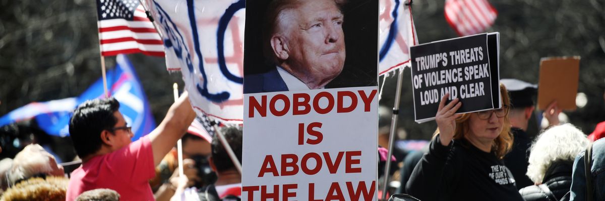 "Nobody is above the law," says sign above 