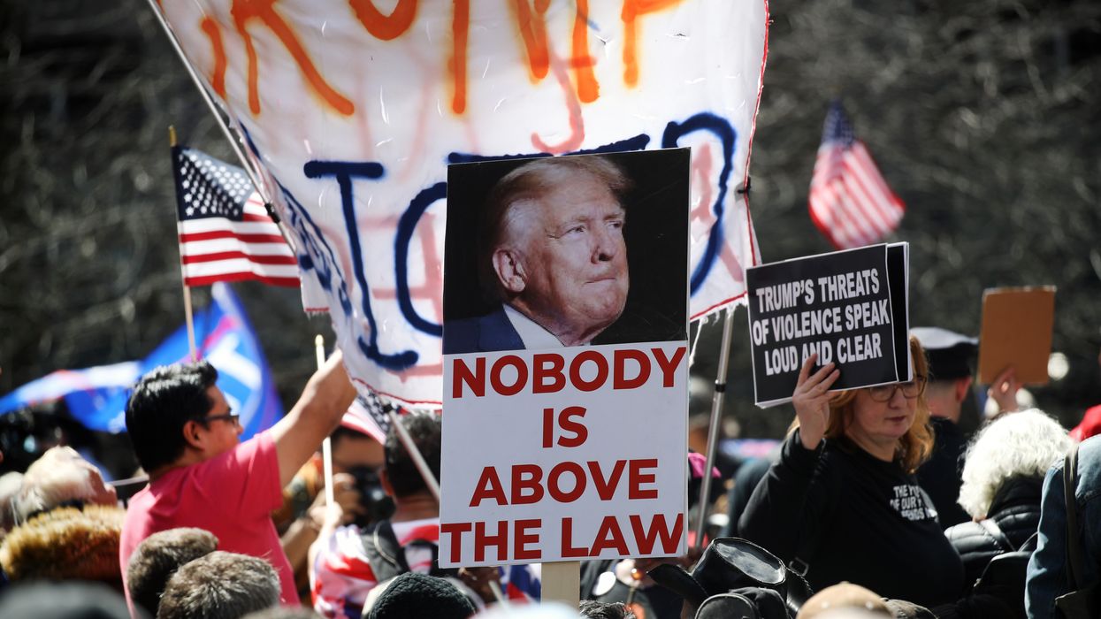 "Nobody is above the law," says sign above