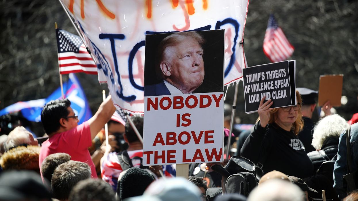 "Nobody is above the law," says sign above