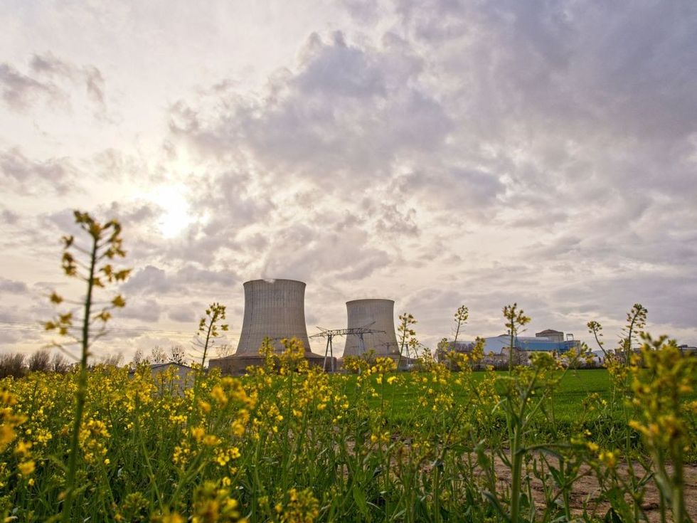 Nuclear reactors above a field.