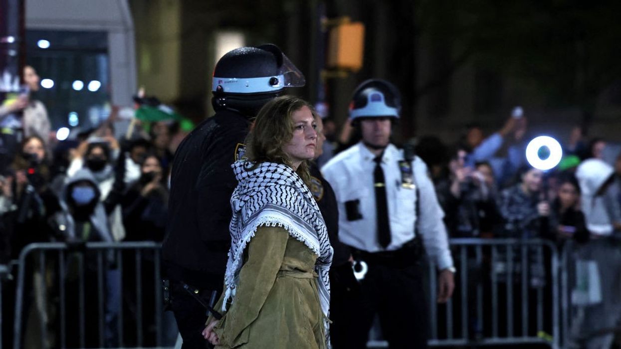 NYPD officers arrest a Columbia University student opposed to the genocide in Gaza