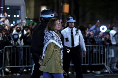 NYPD officers arrest a Columbia University student opposed to the genocide in Gaza