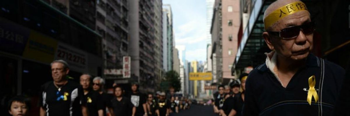 As Pro-Democracy Movement Grows, Thousands March in Hong Kong