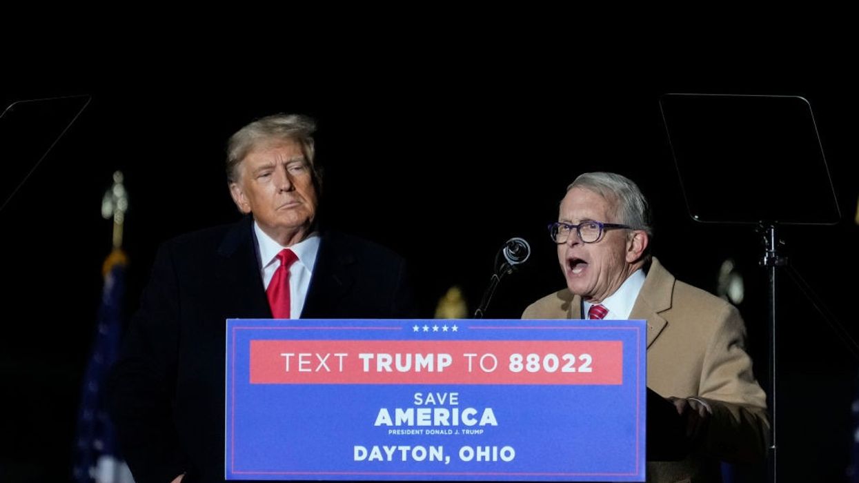Ohio Gov. Mike DeWine speaks as former President Donald Trump looks on