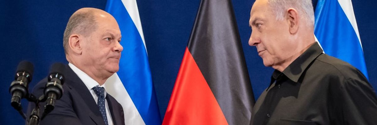 Olaf Scholz shakes hands with Benjamin Netanyahu