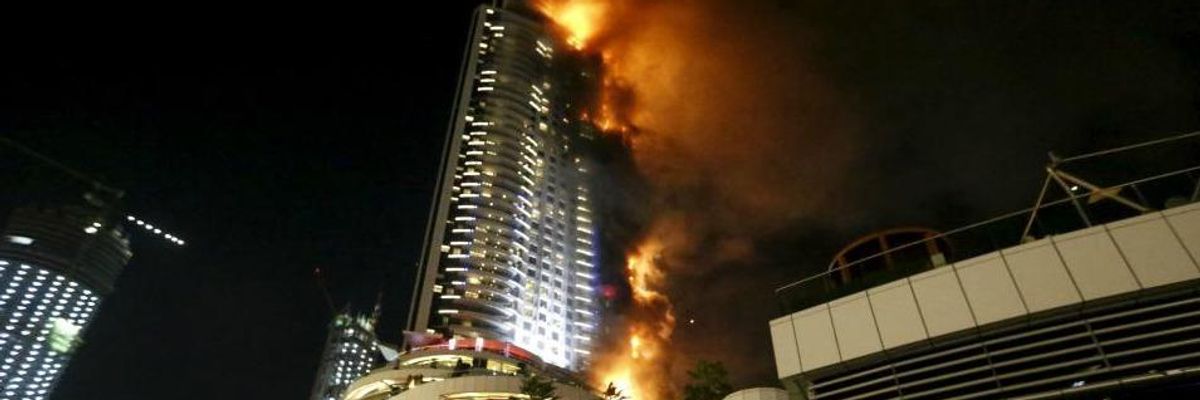 New Year's Eve Pyrotechnics Go On Despite Raging Hotel Fire in Dubai