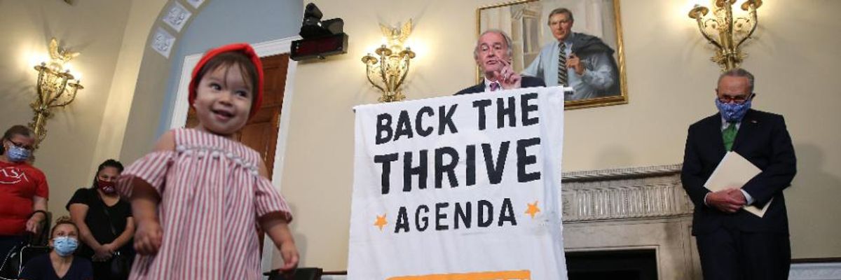 One-year-old Dara Faraez walks across the floor in front of the podium as Sen. Ed Markey (D-Mass.) speaks at the Back the THRIVE Agenda press conference on September 10, 2020 in Washington, D.C.