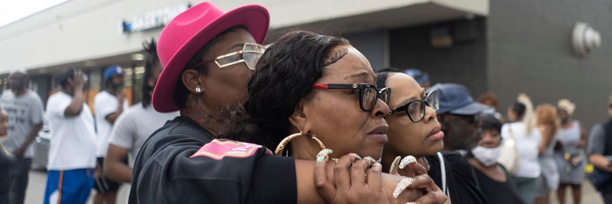 Onlookers outside Buffalo grocery store following mass shooting on Saturday