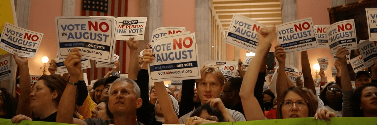 Opponents of Issue 1 hold a demonstration