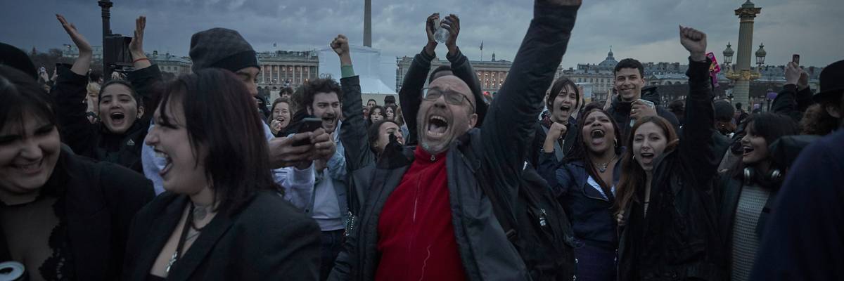 Opponents of raising the French retirement age by two years chant at Place de la Concorde in Paris, France on on March 17, 2023.