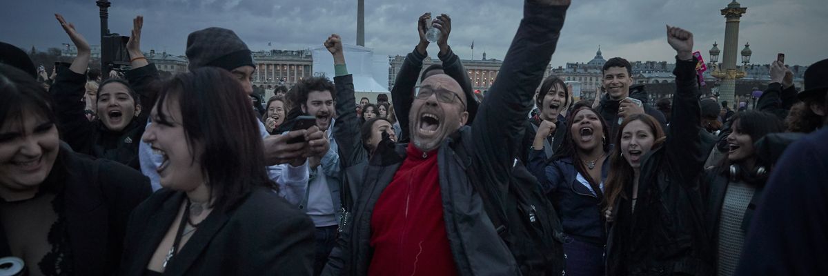 Opponents of raising the French retirement age by two years chant at Place de la Concorde in Paris, France on on March 17, 2023.