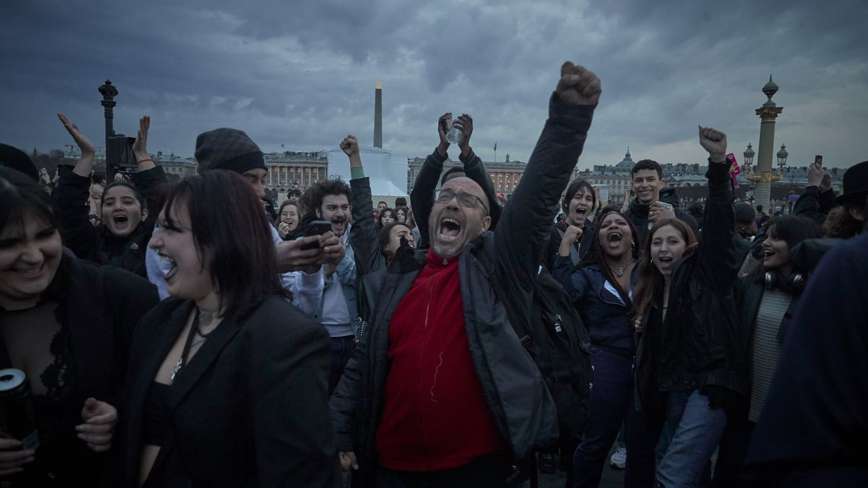 Opponents of raising the French retirement age by two years chant at Place de la Concorde in Paris, France on on March 17, 2023.