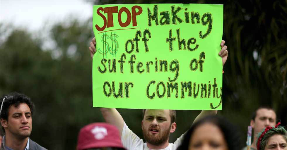 Opponents of the private prison industry have urged companies and cities to divest from for-profit detention facilities and banks that fund them. (Photo: Joe Raedle/Getty Images)
