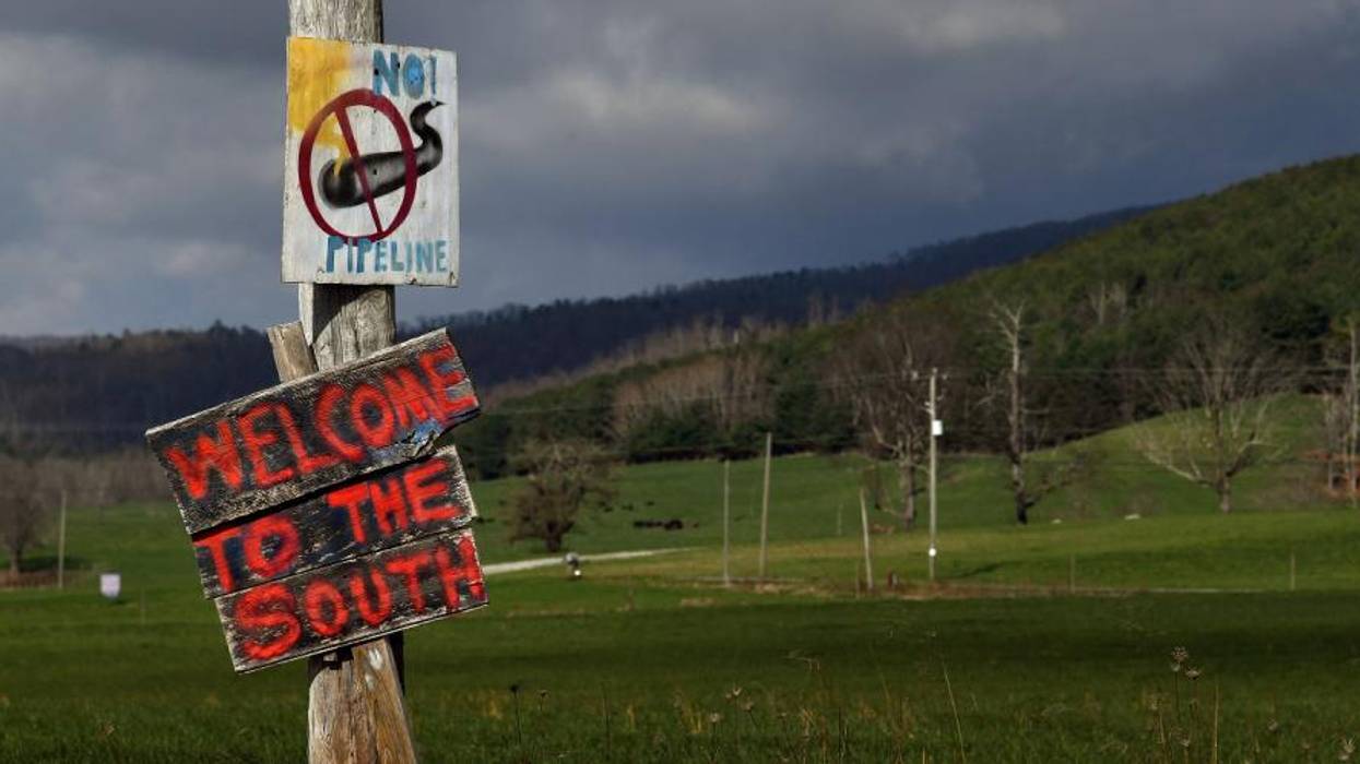 Opposition to the Mountain Valley Pipeline Project is visible on a roadside sign in Bent Mountain, Virginia.
