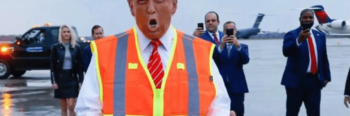 Orange blow-up garbagemen Donald Trump speaks at Green Bay airportt