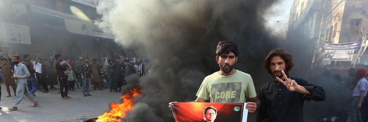 Pakistan Tehreek-e-Insaf party activists and supporters of former Pakistan's Prime Minister Imran protest