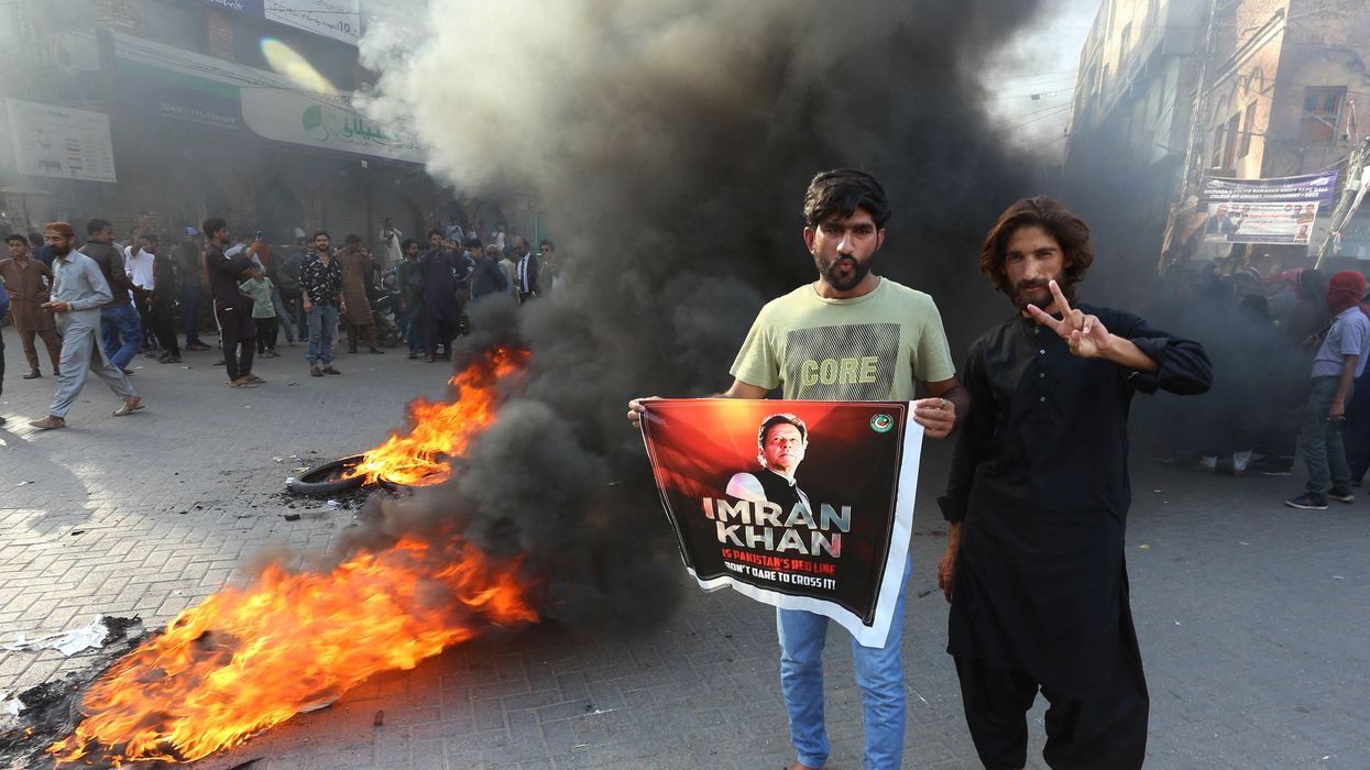 Pakistan Tehreek-e-Insaf party activists and supporters of former Pakistan's Prime Minister Imran protest