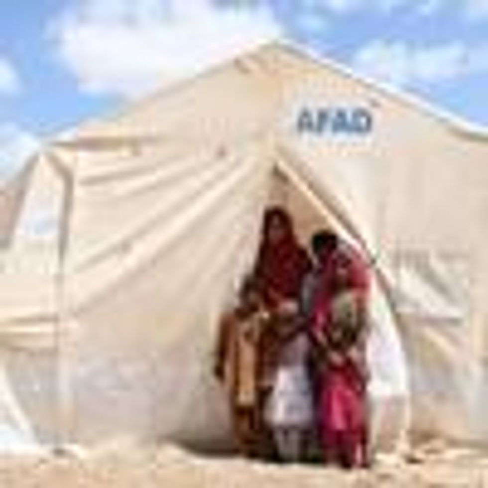 Pakistani flood victims are seen at an emergency tent