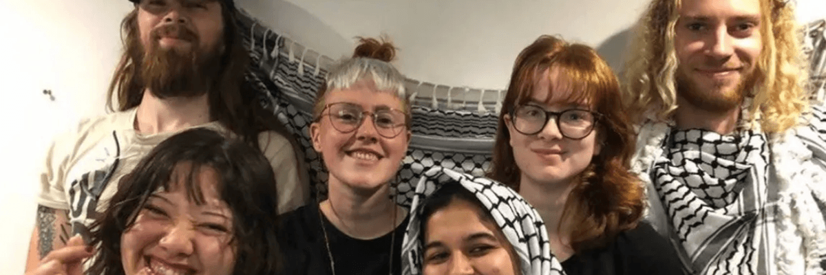 Palestine Action members smile for a photo