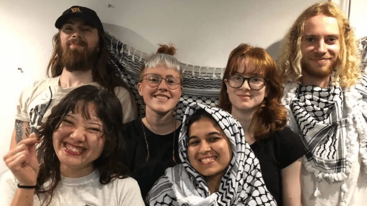 Palestine Action members smile for a photo