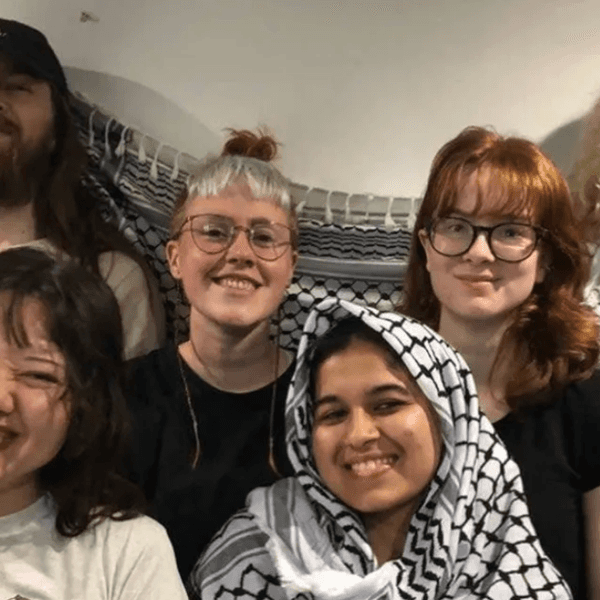 Palestine Action members smile for a photo