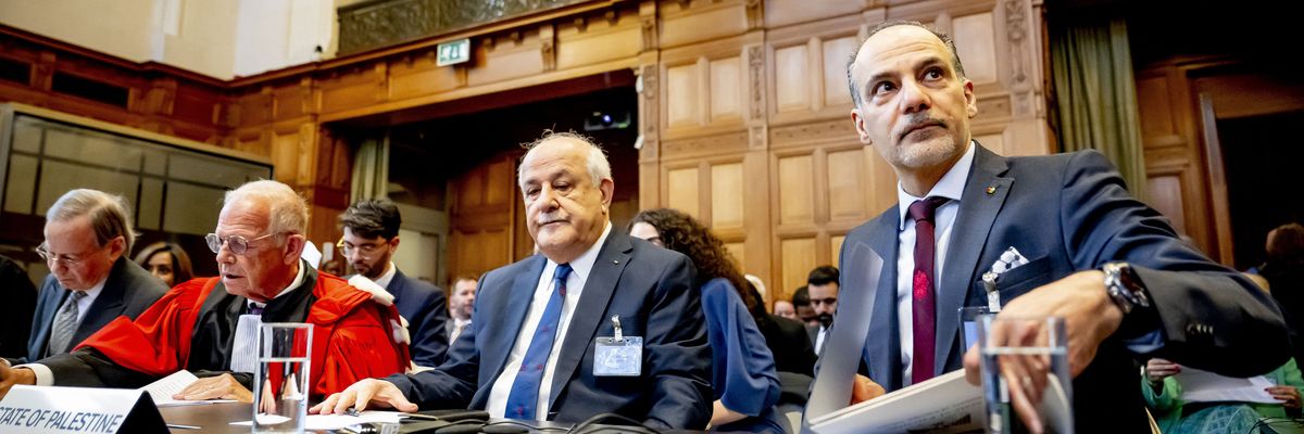 Palestinian ambassador Ammar Hijazi (R)