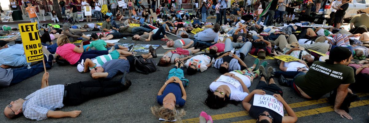 Palestinian Americans and their allies hold a die-in outside CNN headquarters in Los Angeles