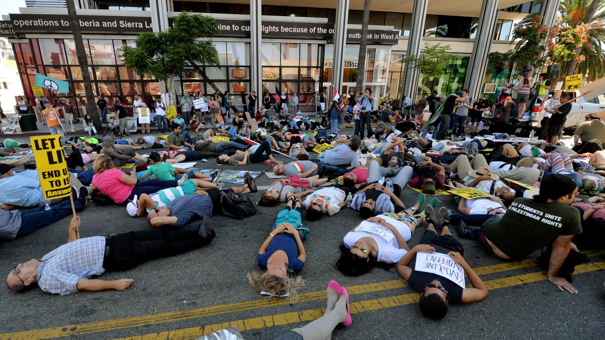 Palestinian Americans and their allies hold a die-in outside CNN headquarters in Los Angeles