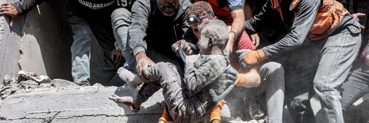Palestinian child removed from rubble