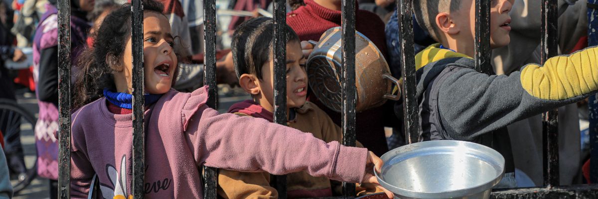 Palestinian children clamor for food in Gaza