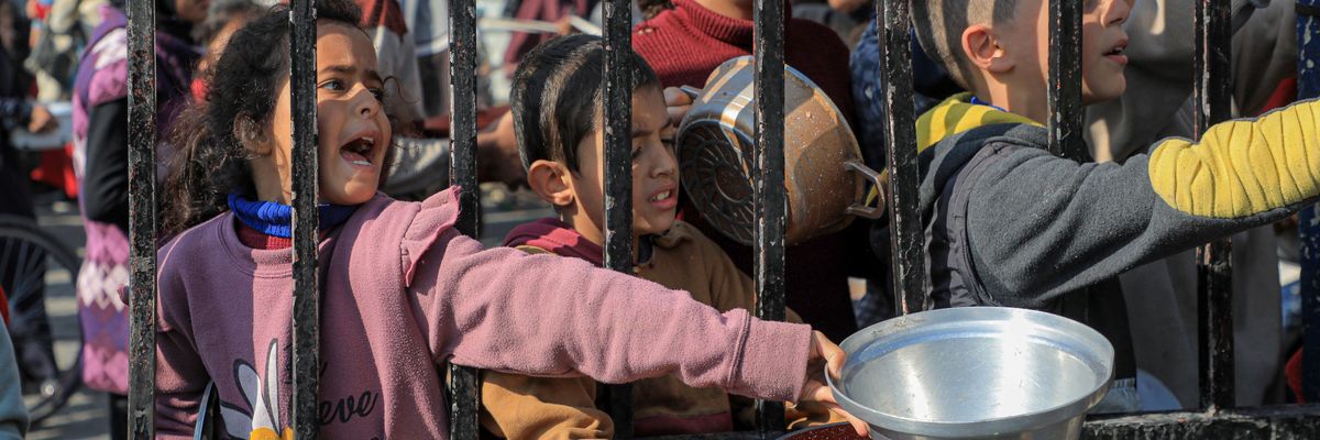 Palestinian children clamor for food in Gaza