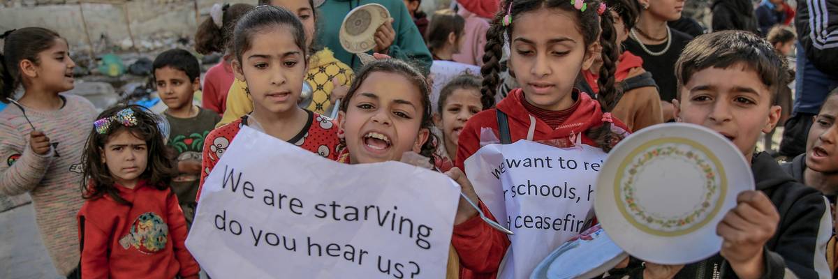 Palestinian children protest against food shortages in Gaza amid Israeli attacks