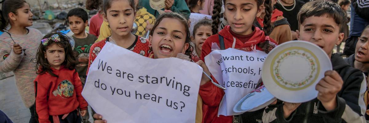 Palestinian children protest against food shortages in Gaza amid Israeli attacks