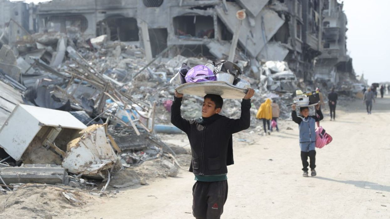 Palestinian children return to their destroyed Gaza neighborhood