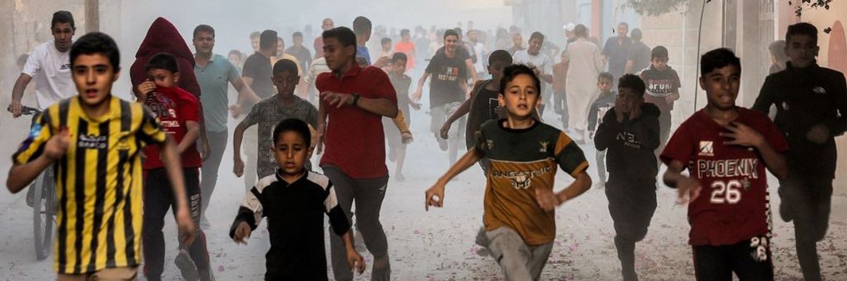 Palestinian children run to flee Israel bombs in Gaza