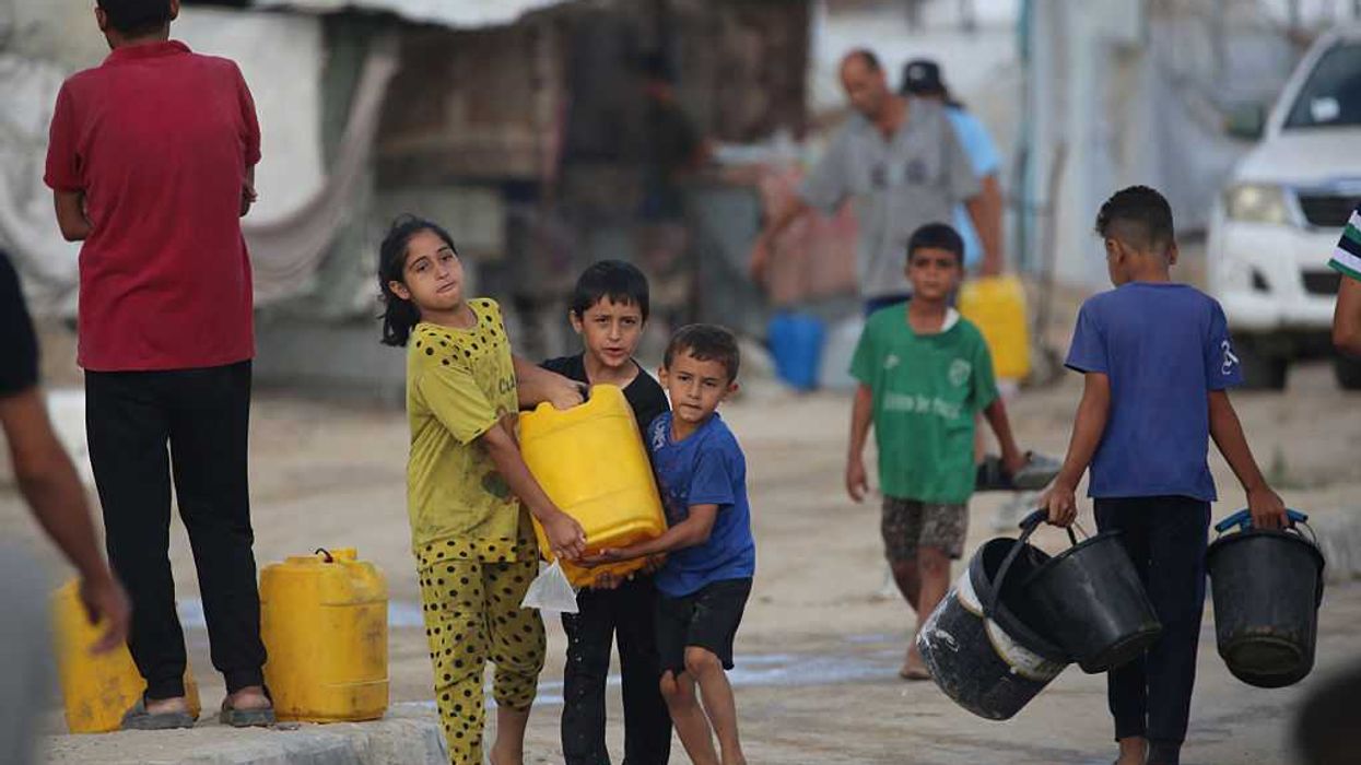 Palestinian children water