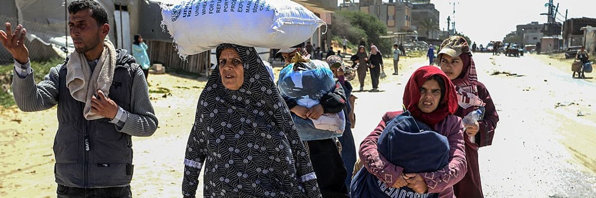Palestinian civilians are flee Rafah carrying their belongings