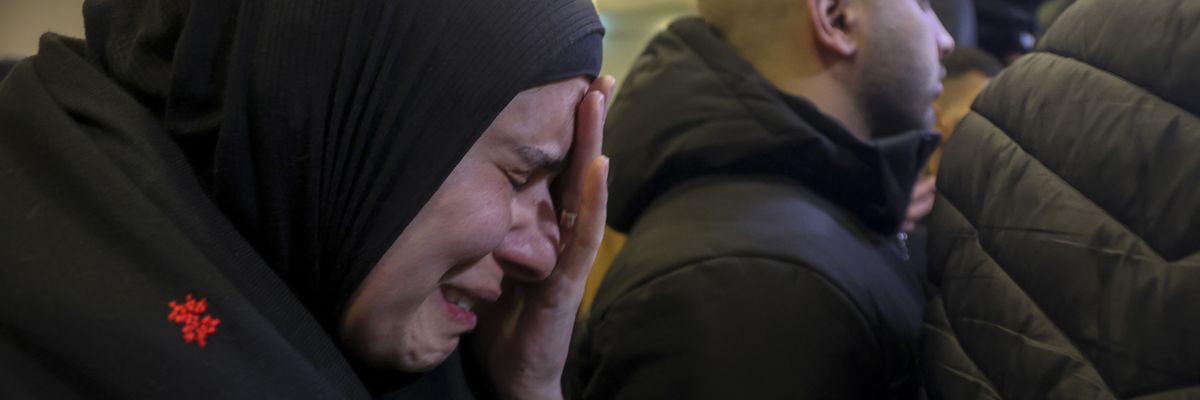 Palestinian families react after Israel delayed the release of Palestinian prisoners