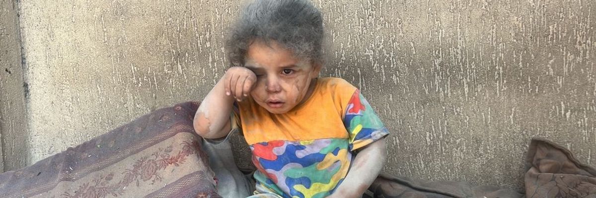 Palestinian girl photographed shortly after Israeli attack