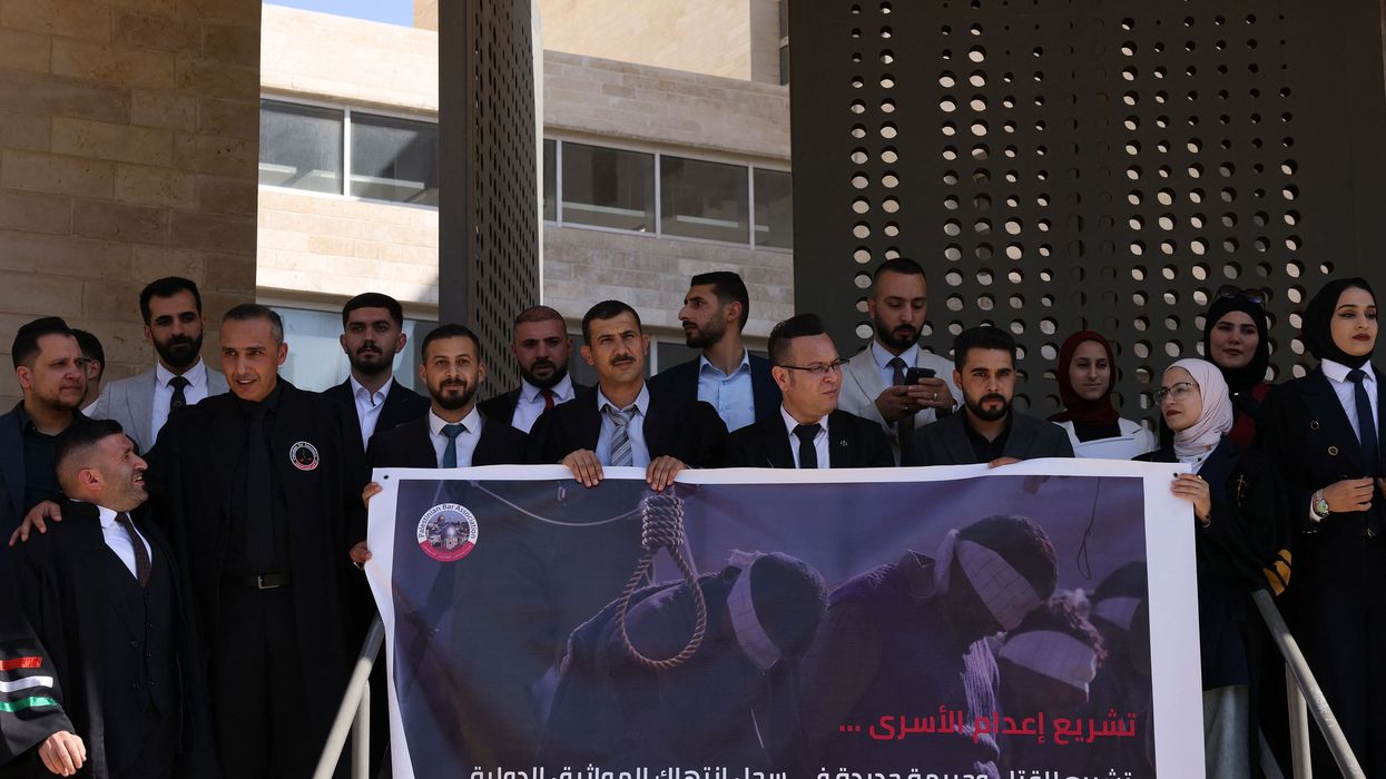 Palestinian lawyers protest against a proposed Israeli death penalty law