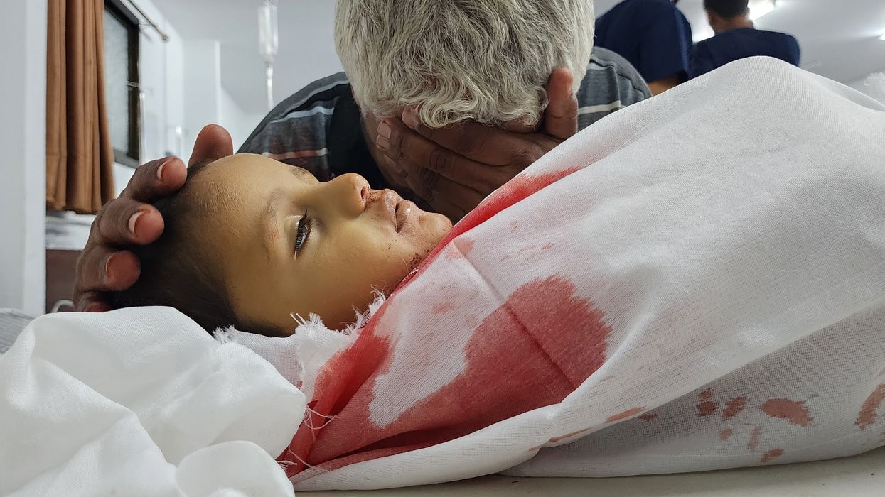 Palestinian man grieves child killed in Rafah bombing.