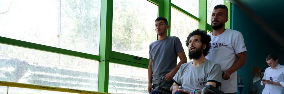 Palestinian man in wheelchair is taken for treatment