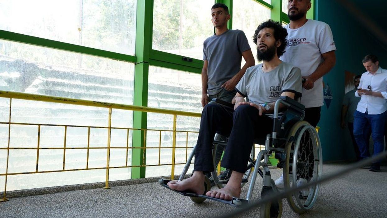 Palestinian man in wheelchair is taken for treatment