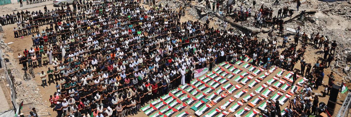Palestinian mourners attend the funeral people