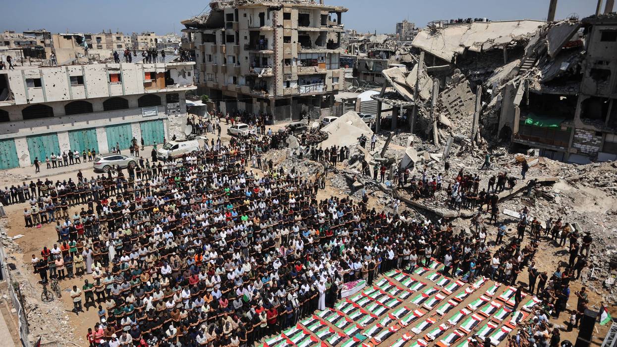 Palestinian mourners attend the funeral people