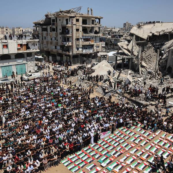 Palestinian mourners attend the funeral people