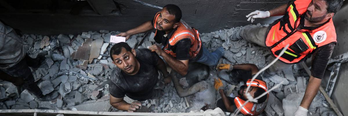 Palestinian rescue workers search rubble
